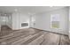 Bright living room with hardwood floors and a modern fireplace at 16910 Cattle Hollow Ln, Noblesville, IN 46060