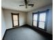 Spacious bedroom with ceiling fan and large windows at 202 N State St, Greenfield, IN 46140