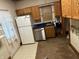 Galley kitchen includes wood cabinets and modern appliances at 202 N State St, Greenfield, IN 46140