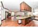 Kitchen with granite counter, wood cabinets, and hardwood floors at 350 N Meridian St # A301, Indianapolis, IN 46204