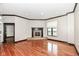 Spacious living room featuring hardwood floors, a fireplace, and large windows at 350 N Meridian St # A301, Indianapolis, IN 46204