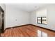 Hardwood floors and large window in this bright bedroom at 350 N Meridian St # A301, Indianapolis, IN 46204