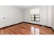 Spacious bedroom featuring hardwood floors and ample natural light at 350 N Meridian St # A301, Indianapolis, IN 46204