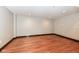 Empty basement room with hardwood floors at 350 N Meridian St # A301, Indianapolis, IN 46204