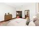 Bedroom with hardwood floors, a view of the living area, and bathroom access at 350 N Meridian St # A301, Indianapolis, IN 46204
