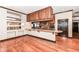 Modern kitchen features granite countertops, stainless steel appliances, and hardwood floors at 350 N Meridian St # A301, Indianapolis, IN 46204