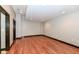 Empty basement room with hardwood floors at 350 N Meridian St # A301, Indianapolis, IN 46204