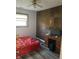 Bedroom with a red bedspread, desk and corkboard wall at 6820 Hi Vu Dr, Indianapolis, IN 46227