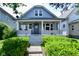 Charming bungalow features a front porch and well-manicured landscaping at 278 N Mount St, Indianapolis, IN 46222