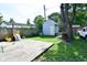 Backyard with shed, large tree, and concrete patio at 278 N Mount St, Indianapolis, IN 46222