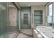 Spa-like bathroom featuring a soaking tub, walk-in shower, and rainfall shower head at 1 N Illinois St # 2101, Indianapolis, IN 46204