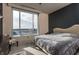 Bright bedroom with a large window offering city views at 1 N Illinois St # 2101, Indianapolis, IN 46204