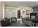 Home office with a large desk, comfortable seating, and glass feature wall at 1 N Illinois St # 2101, Indianapolis, IN 46204