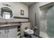 Modern bathroom with a walk-in shower, patterned tile, and floating vanity at 1 N Illinois St # 2101, Indianapolis, IN 46204