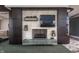 Modern fireplace with dark wood surround and built-in shelving at 1 N Illinois St # 2101, Indianapolis, IN 46204