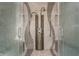 Large walk-in shower with multiple shower heads and glass enclosure at 1 N Illinois St # 2101, Indianapolis, IN 46204
