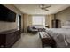 Main bedroom with a king-size bed, sitting area, and city views at 1 N Illinois St # 2101, Indianapolis, IN 46204