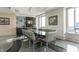 Modern dining room featuring a glass-top table and city views at 1 N Illinois St # 2101, Indianapolis, IN 46204