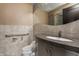 Bathroom with curved vanity, tiled walls, and accessible features at 1 N Illinois St # 2101, Indianapolis, IN 46204