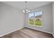 Bright breakfast nook with hardwood floors and large window at 16848 Cattle Hollow Ln, Noblesville, IN 46060