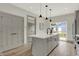 Modern kitchen with gray cabinets, white quartz countertops and island, stainless steel appliances at 220 Sanders St, Indianapolis, IN 46225