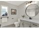 Simple bathroom with single vanity and toilet at 220 Sanders St, Indianapolis, IN 46225