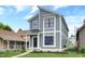 Modern two-story home with gray siding and metal roof at 220 Sanders St, Indianapolis, IN 46225