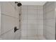Clean bathroom with a shower and built-in shelving at 220 Sanders St, Indianapolis, IN 46225