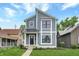 Modern two-story home with gray siding and metal roof at 220 Sanders St, Indianapolis, IN 46225