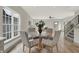 Bright dining room with round table and four chairs, hardwood floors, and large window at 220 Sanders St, Indianapolis, IN 46225