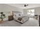 Spacious bedroom with large window, ceiling fan, and ample floor space at 220 Sanders St, Indianapolis, IN 46225