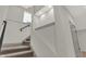 Modern staircase with simple railing and gray carpeting at 220 Sanders St, Indianapolis, IN 46225