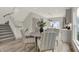 Open concept dining area with kitchen views, round table and chairs, hardwood floors at 220 Sanders St, Indianapolis, IN 46225