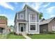 Modern two-story home with gray siding and metal roof at 220 Sanders St, Indianapolis, IN 46225
