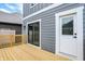 Wooden deck with sliding glass door and white door access at 220 Sanders St, Indianapolis, IN 46225
