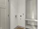 Small laundry room with washer and dryer hookups and shelving at 220 Sanders St, Indianapolis, IN 46225