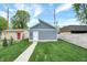 Detached gray garage with white door and walkway at 220 Sanders St, Indianapolis, IN 46225