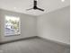 Bright bedroom featuring a large window and ceiling fan at 220 Sanders St, Indianapolis, IN 46225