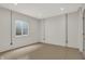 Unfinished basement room with window and neutral walls at 220 Sanders St, Indianapolis, IN 46225