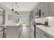 Modern kitchen with gray cabinets, white quartz countertops, and stainless steel appliances at 220 Sanders St, Indianapolis, IN 46225