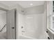 Clean bathroom with bathtub and shower combo at 220 Sanders St, Indianapolis, IN 46225