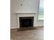 Elegant fireplace with marble surround in living room at 533 Gosford Ct, Westfield, IN 46074