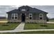 Brick house with a gray roof and walkway at 1157 Paul Revere Dr, Mooresville, IN 46158