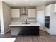 Modern kitchen with white cabinets, quartz countertops, and a large island at 1157 Paul Revere Dr, Mooresville, IN 46158