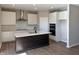 Eat-in kitchen boasting stainless steel appliances, an island, and white cabinetry at 1157 Paul Revere Dr, Mooresville, IN 46158