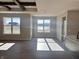 Bright living room with hardwood floors, wood beams, and large windows offering scenic views at 1157 Paul Revere Dr, Mooresville, IN 46158
