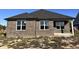 Brick house with a dark gray roof and a covered patio at 1157 Paul Revere Dr, Mooresville, IN 46158
