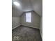 Bright attic bedroom with gray carpet and window at 207 E Wall St, Advance, IN 46102