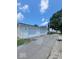 Three-car garage with white siding and lighting at 207 E Wall St, Advance, IN 46102