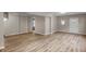 Bright living room with laminate floors and access to other rooms at 618 N Gladstone Ave, Indianapolis, IN 46201